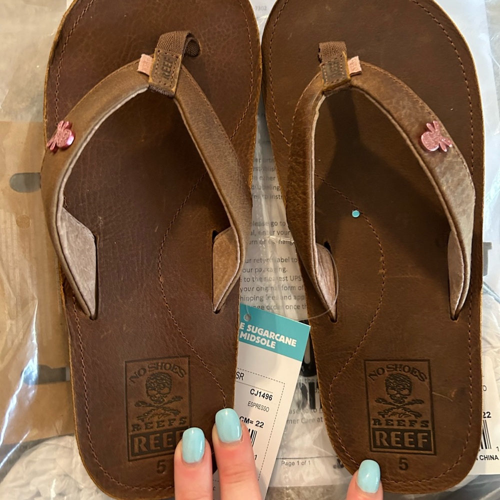 Brand new reef flip flops brown with tags size 5